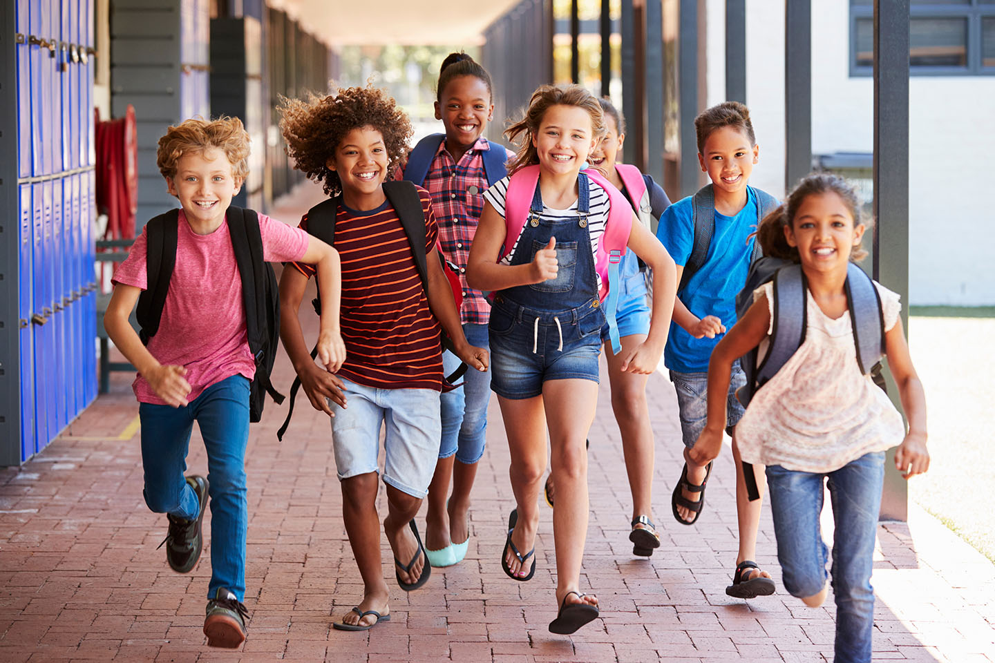 kids running in hallway smiling